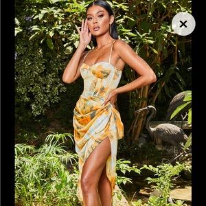 BRAND NEW WITH TAGS, NEVER WORN. PLT ORANGE SKIRT AND CORSET SET.